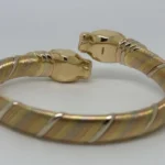 Bracelet Cartier Panthère Cougar Trinity en or jaune, blanc et rose 18 carats, service 2025