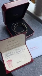 Bracelet jonc Cartier Trinity Tricolore en or 18 carats, modèle classique